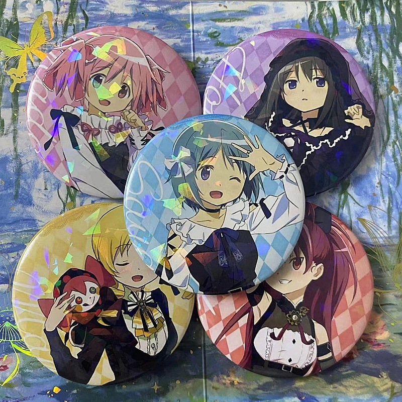 Puella Magi Madoka Magica the Movie: Rebellion merchandise - tin badges and badges featuring Madoka Kaname and Homura Akemi.