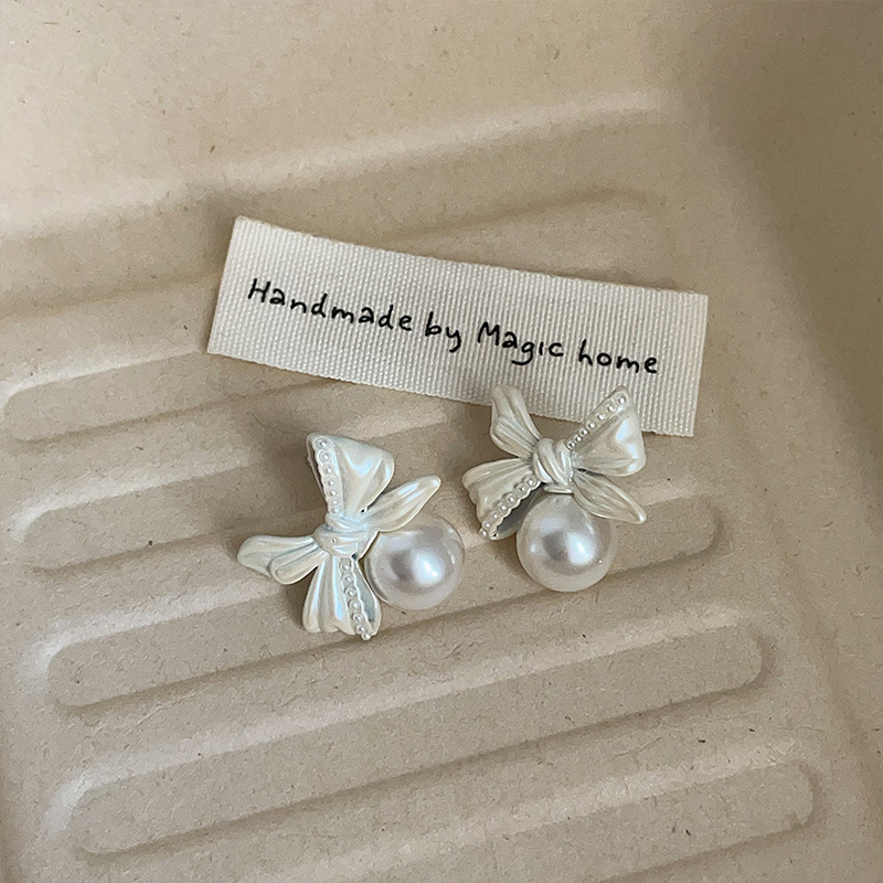 Earrings pearl with bow, silver 925 sample