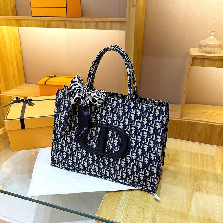 Bolsa grande para mujeres 2025 nueva moda red lienzo rojo de moda bolsa de hombro brazo universal de gran capacidad bolso de mano