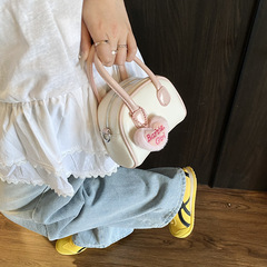 2025新型韓国版は色のボーリングの子供の親子の項にぶつかって斜めに肩を掛けて小さい包みの女性のカバンの卸売りを飾ります。