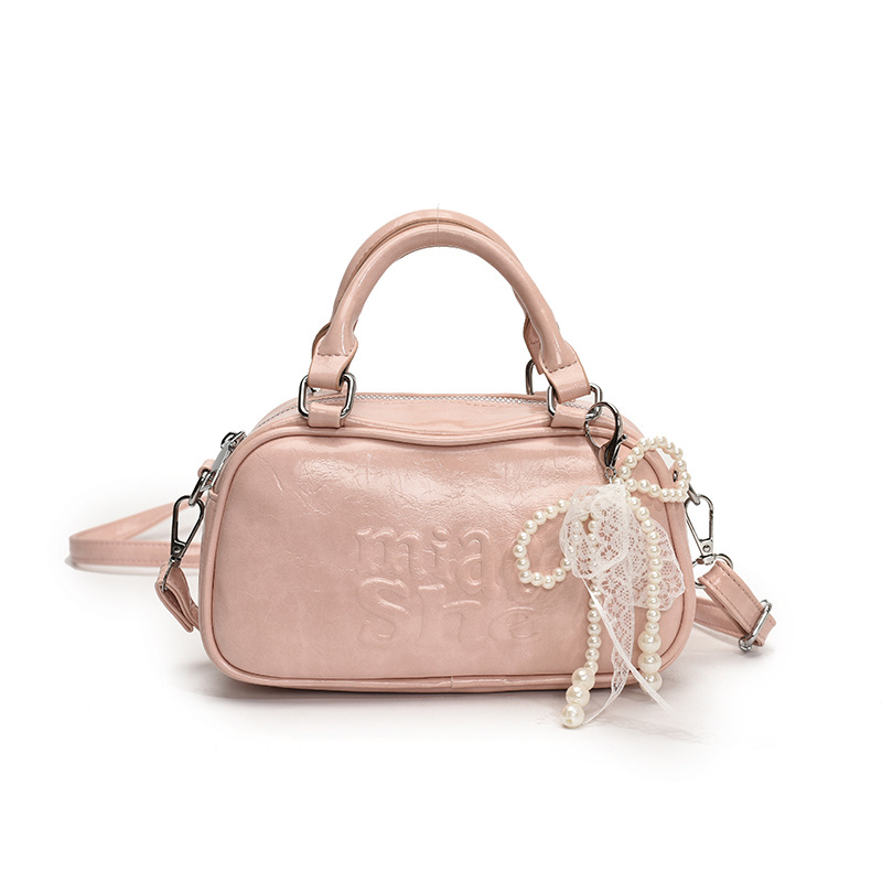 Versión coreana del bolso de bolos de mano para mujer 2025 nuevo bolso de hombro de moda de moda bolso de mensajero popular casual de todo fósforo