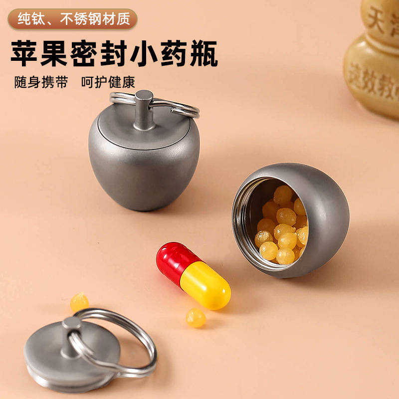 Creativo de acero inoxidable de Apple pequeña botella de la medicina caja de medicina portátil llavero Primeros Auxilios medicina tanque sellado de titanio puro almacén impermeable