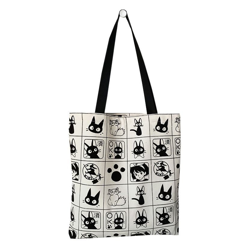 Bolsa de lona 2025 para mujer, versátil, con diseño de gato de dibujos animados, para estudiantes, con cremallera, tipo satchel.