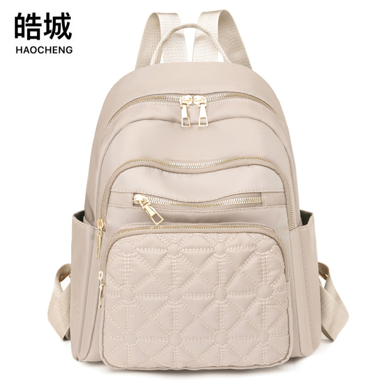 2024 nuevo color sólido de las mujeres ocasionales mochila moda todo partido urbano de cercanías mochila de viaje al aire libre al por mayor