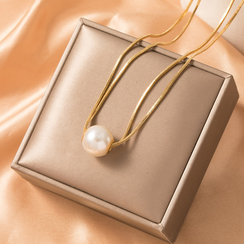 Double-layer stacked pearl titanium steel necklace, fashionable and elegant, versatile clavicle chain for women with elegant niche design.