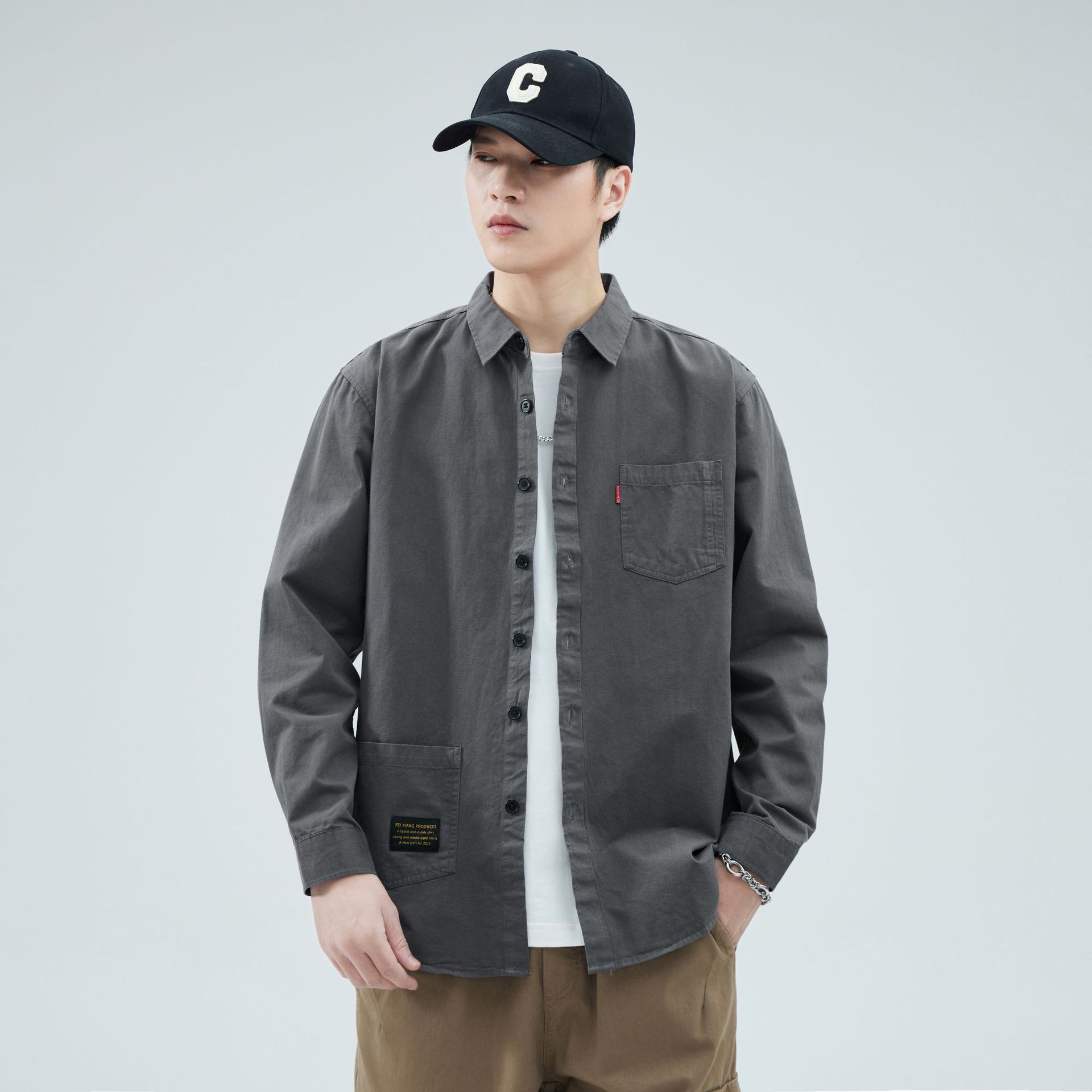 Camisas personalizadas de fábrica para hombres primavera y verano algodón de manga larga tendencia de ropa de estilo americano con solapa de bolsas de moda de ropa de estilo