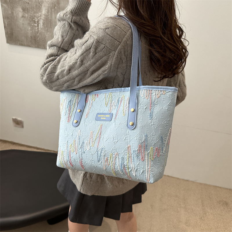 Bolsa de gran capacidad de viaje ocio para mujeres 2024 nueva moda para estudiantes universitarios en clase de hombro único bordado rayas bolsa de mano