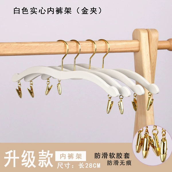White trouser rack with gold hook