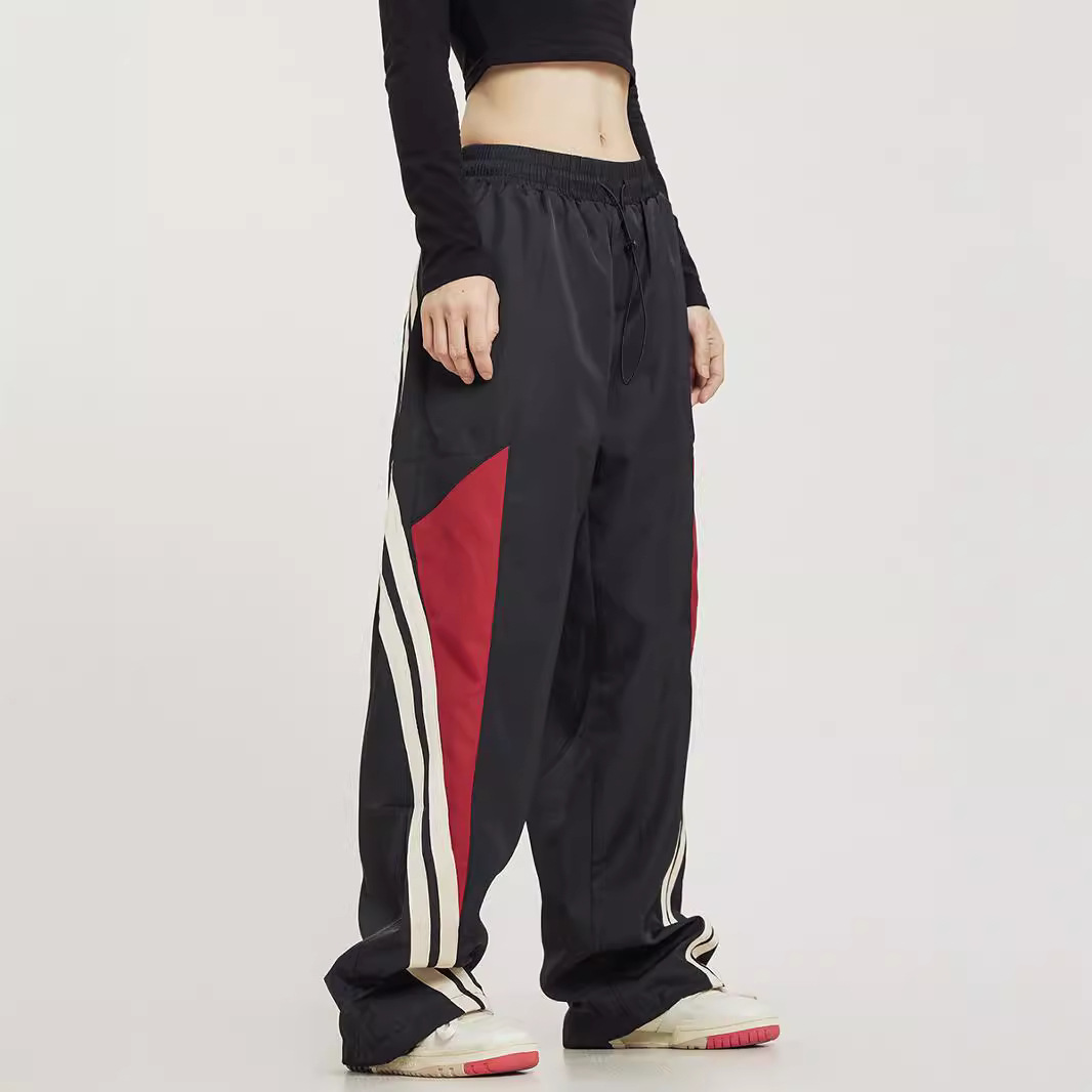 Pantalones deportivos a juego con rayas laterales de baile callejero retro americano para hombres y mujeres pantalones anchos sueltos rectos de primavera y otoño