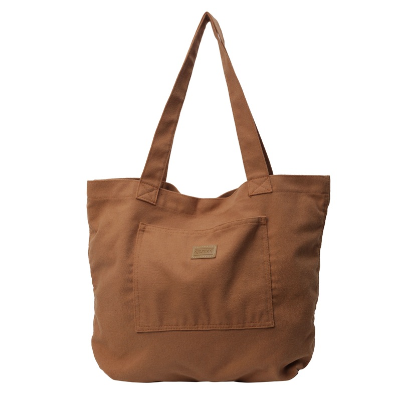 Bolso de lona para mujer 2024 nuevo bolso de hombro de gran capacidad de color sólido casual simple y versátil bolso de clase al por mayor
