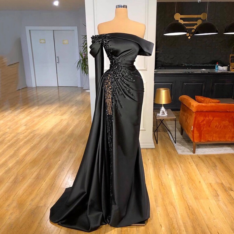 European and American style, lightweight luxury black one-shoulder satin mermaid gown, featuring intricate detailing, sheer panels, and a slit, perfect for parties and evening events European and American style, lightweight luxury black one-shoulder satin mermaid gown, featuring intricate detailing, sheer panels, and a slit, perfect for parties and evening events