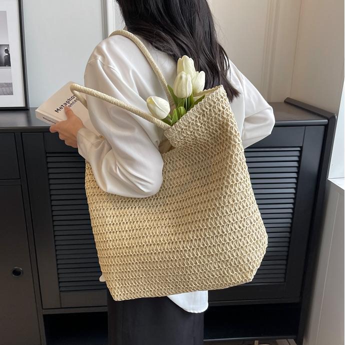 Verano simple y popular bolso de paja femenino 2025 nuevo estilo estilo occidental tejido bolso de playa bolso de viaje de gran capacidad