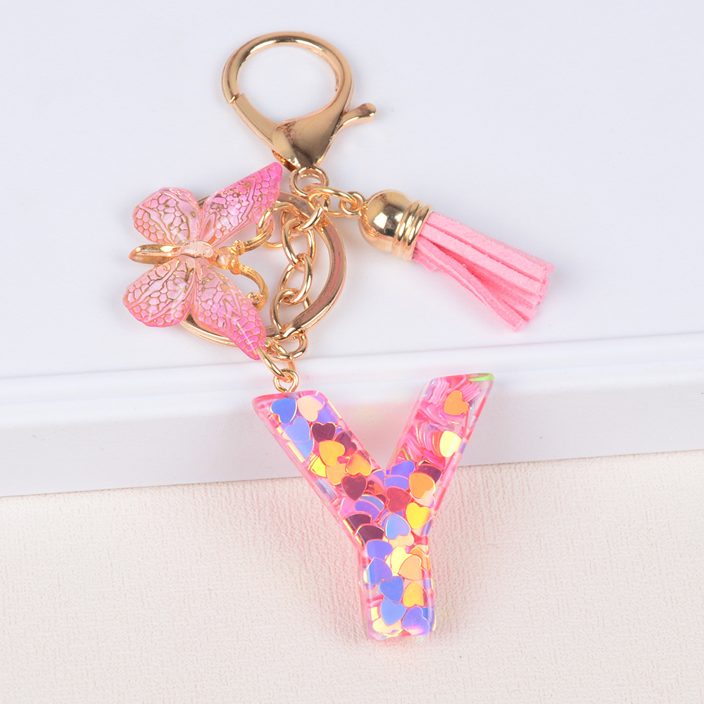 Explosiones transfronterizas amor sequillas iniciales llavero al por mayor resina letra mariposa fringe llavero se puede personalizar