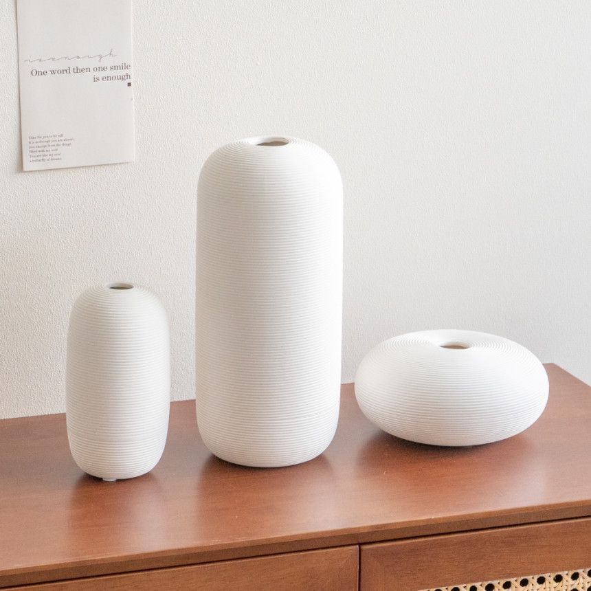 Nuevo chino cerámica florero decoración del hogar artesanía moderna simple Zen blanco flor titular de la flor al por mayor