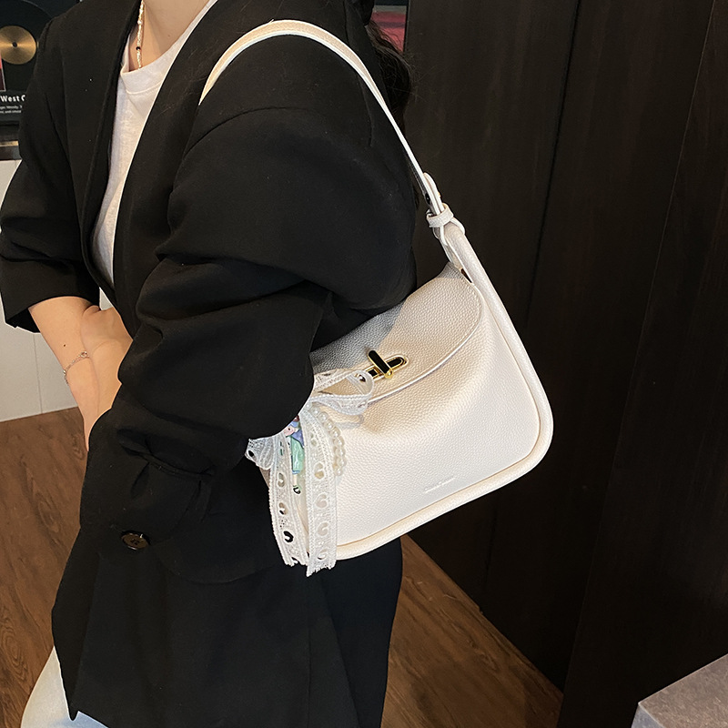 Bolso de brindis de diseño de nicho para mujer 2025 nuevo bolso de mano con patrón de lichi coreano, bolso de almohada de mensajero de un solo hombro