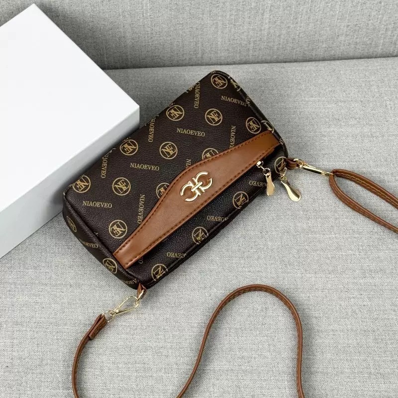 Guangzhou Hengli 2024 nuevo bolso de mensajero transfronterizo bolso casual de mediana edad bolso de teléfono móvil para mujer bolso de venta caliente bolso de hombro