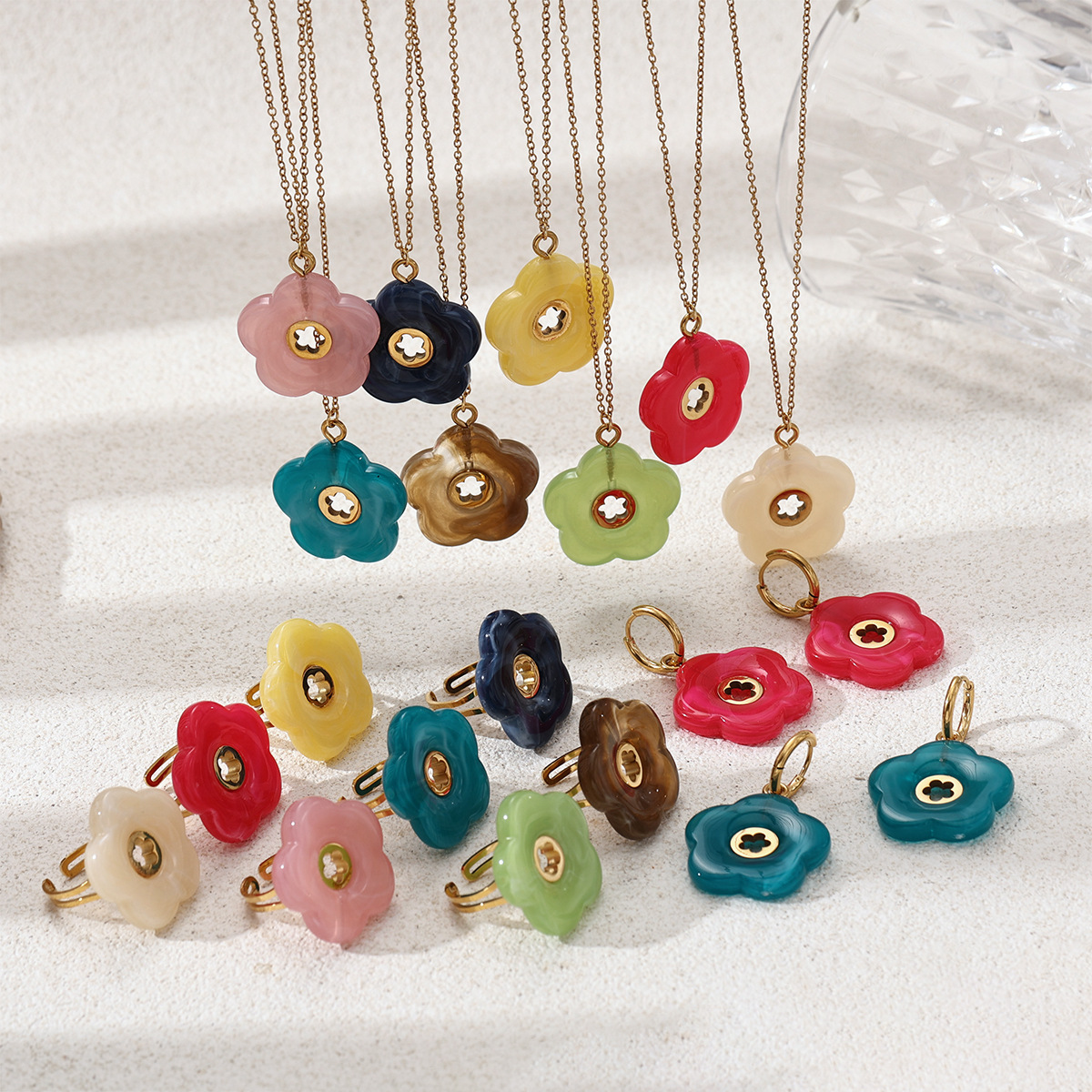 Alta Europa y América acero inoxidable ligero lujo alto sentido flores acrílico titanio joyería conjunto de aretes primavera y verano nuevos productos