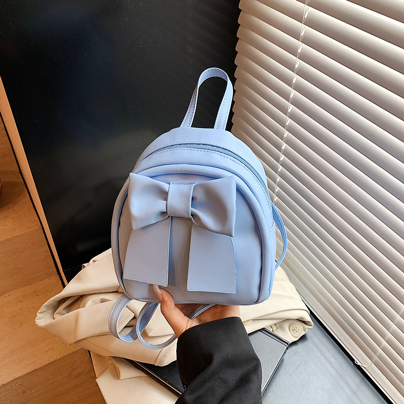 Lindo bolso pequeño con lazo simple 2025 verano nuevo estilo diseño sentido mochila pequeña moda estilo occidental mochila salvaje