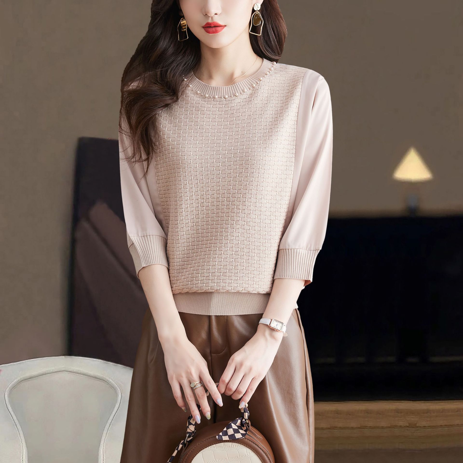 Autumn knitted fashionable elegant sweater with a round collar