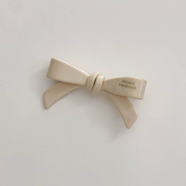 With bow, beige