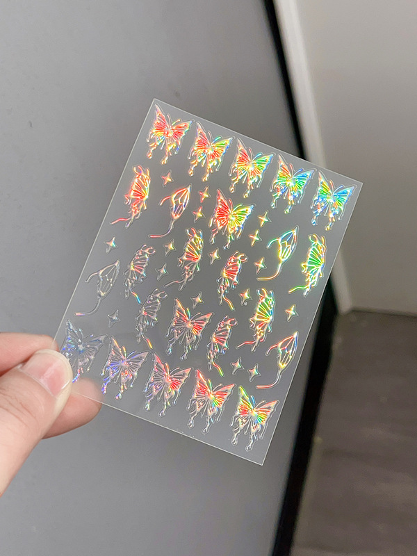 液体の蝶のネイルシールの立体レーザーと金銀の白黒の蝶の薄い靭性帯のゴムを背負って花の爪を貼って卸売りを貼ります。|undefined