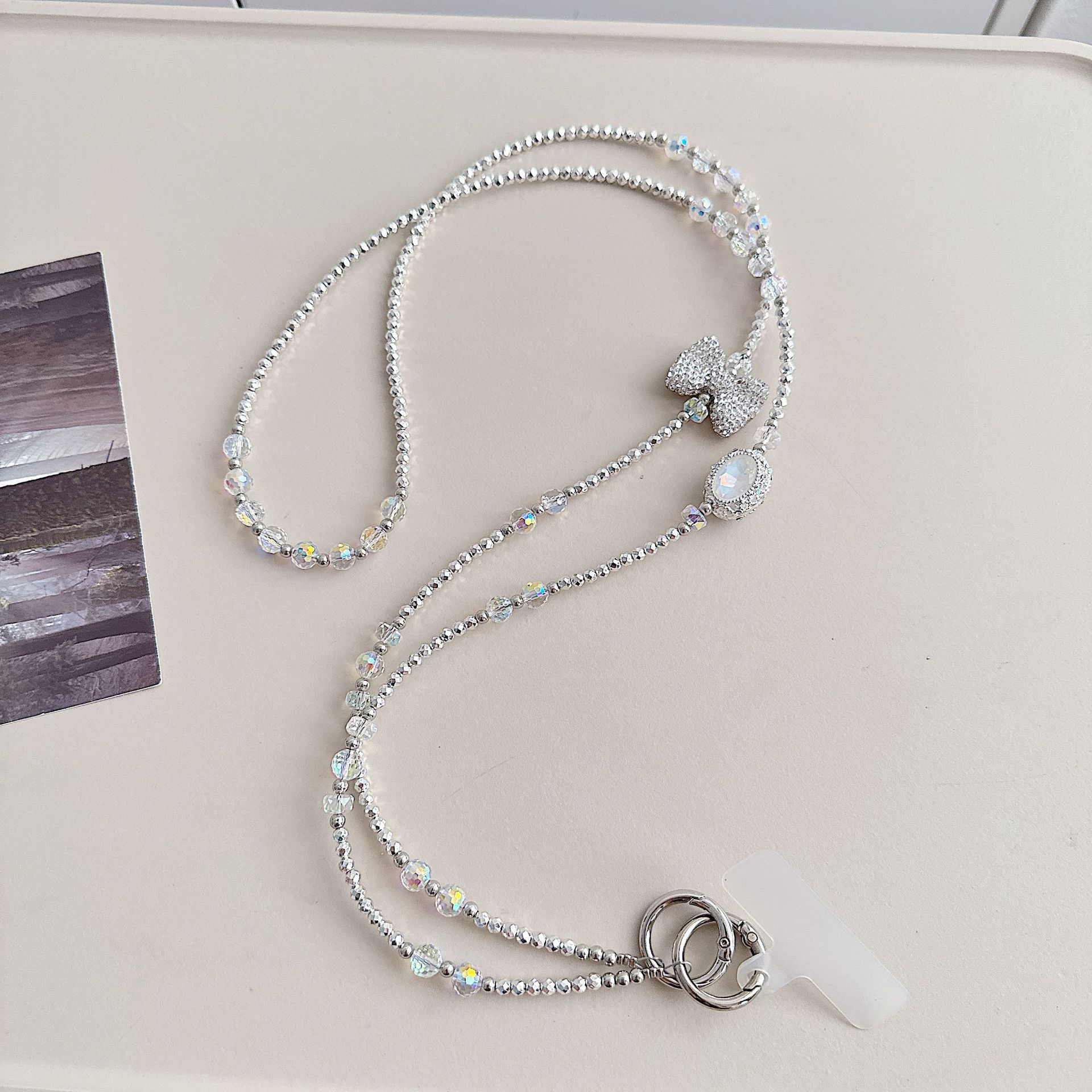 Boutique hecho a mano de alta gama teléfono móvil cadena colgante ins mujer ligero lujo dulce fresco estilo princesa moda teléfono móvil cadena colgante mensajero largo