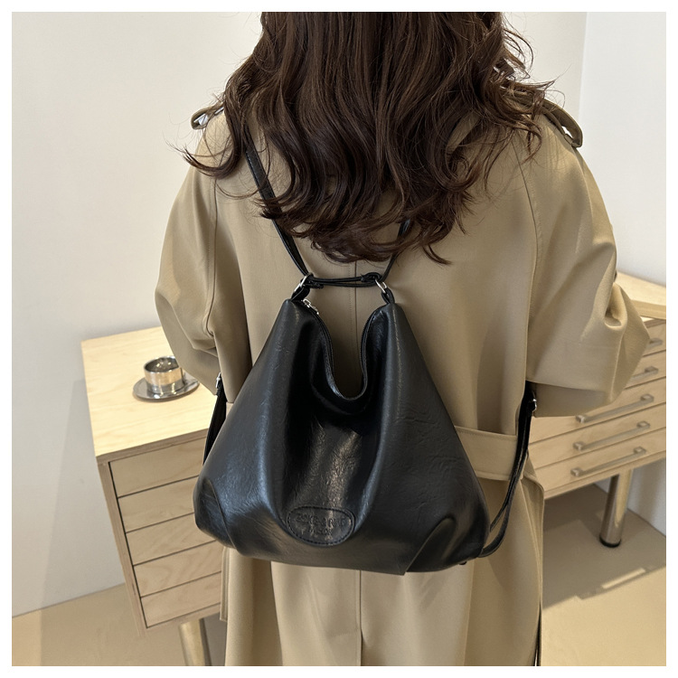 The 2024 new pleated tote bag is a large-capacity casual and fashionable backpack for women, featuring multi-functional texture and a single-shoulder crossbody bag undefined
