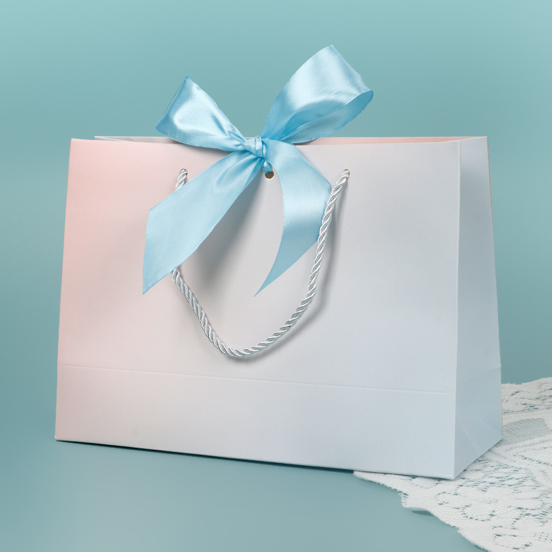 Bolso de papel arco bolsa de impresión ropa bolsa de regalo bolsa de compras bolsa de embalaje bolsa de cosméticos