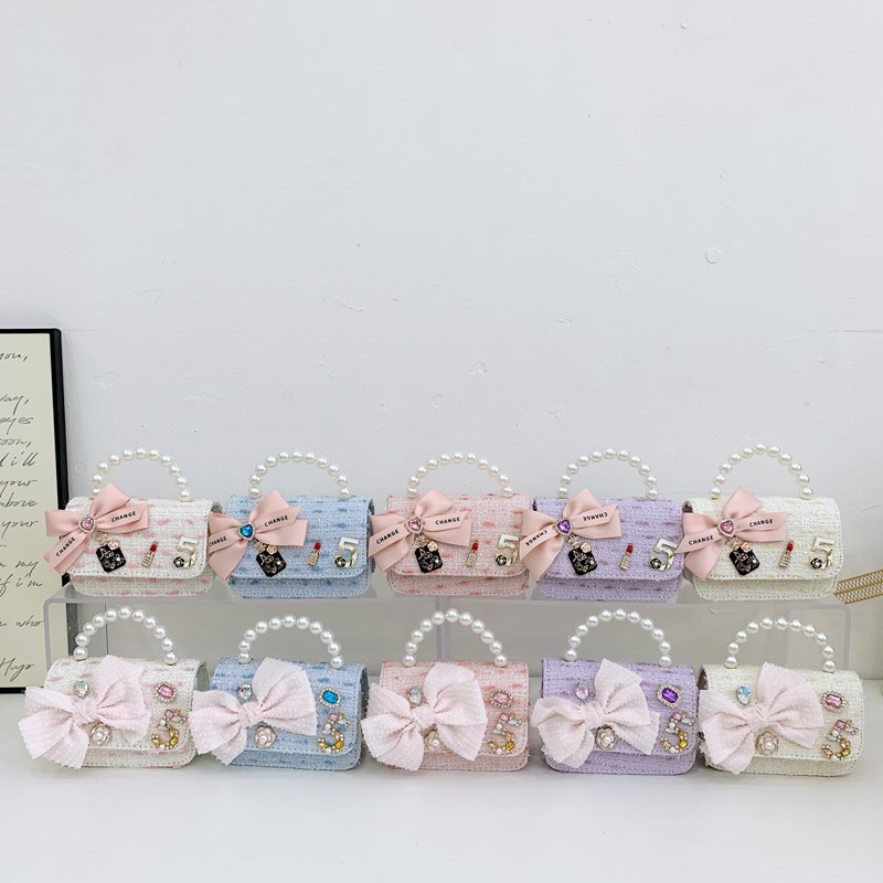 Bolso de cinturón para niños bolso de cambio pequeño viento perla de moda bolso de arco bolso de niña linda