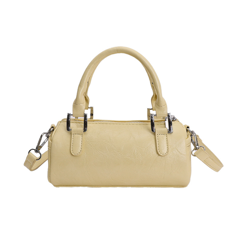 Nicho de diseño retro bolso de mano mujer 2026 primavera nuevo bolso de hombro sensación diaria de moda oblicuo bolso cilíndrico