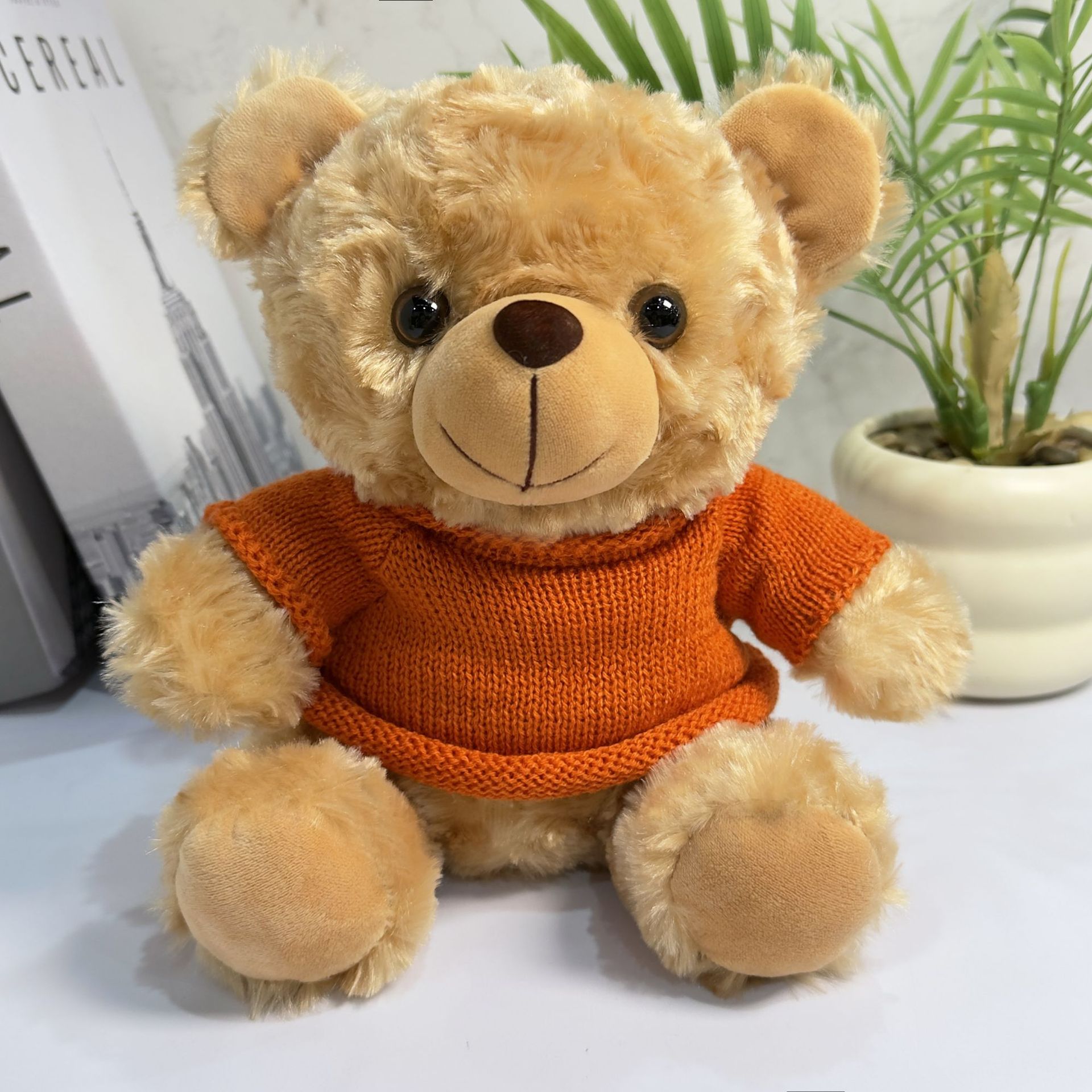 El oso marrón - suéter naranja