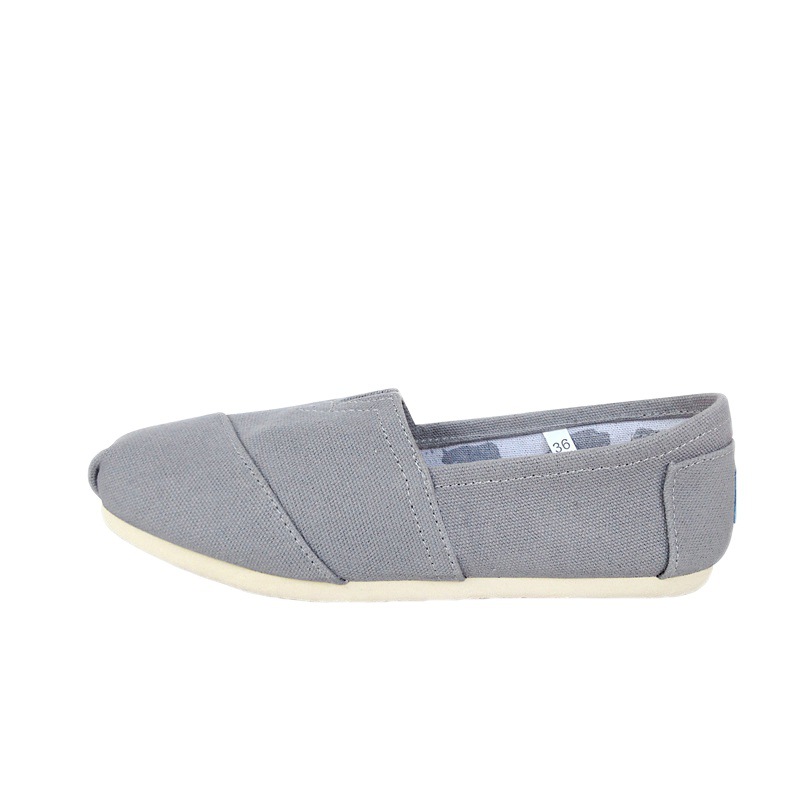 Comercio exterior transfronterizo europeo y americano Thomas zapatos de tela zapatos de lona para hombres y mujeres zapatos planos perezosos de color sólido de pareja sin cordones