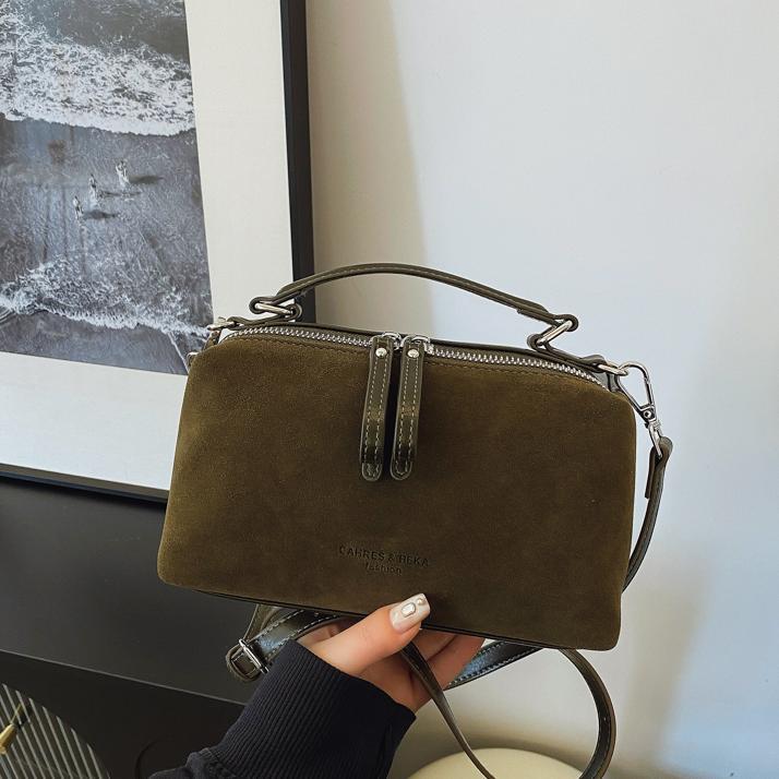 Invierno de moda mochila de textura esmerizada para mujeres 2025 nueva bolsa de hombro de mano casual de alta calidad sensación versátil mochila