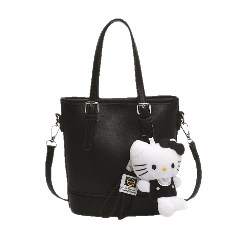 2025 nuevo bolso de cubo portátil de diseño de nicho bolso de hombro de viajero de todo fósforo de moda femenina bolso de mensajero de estilo occidental de color sólido