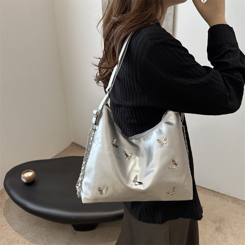 Bolso de cadena de moda popular para mujeres 2024 verano nuevo bolso de hombro de gran capacidad nicho mariposa mochila de trabajo