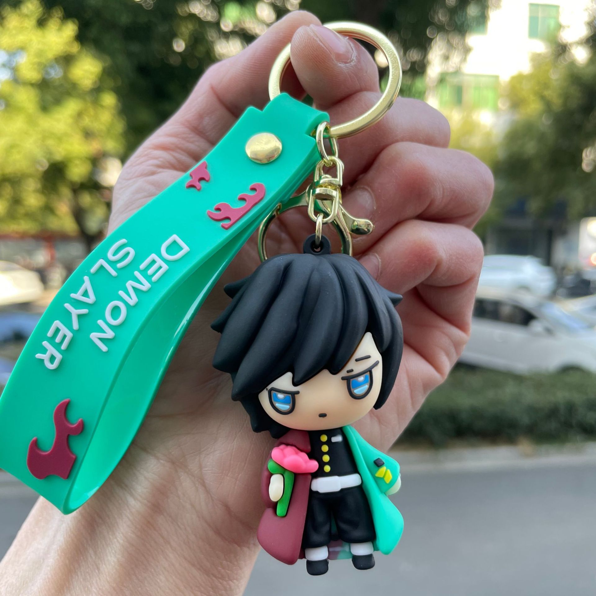 鬼滅の刃の鍵は自動車のキーチェーンの漫画の公仔のかばんのペンダントの子供機の小さい贈り物の卸売りを掛けます。