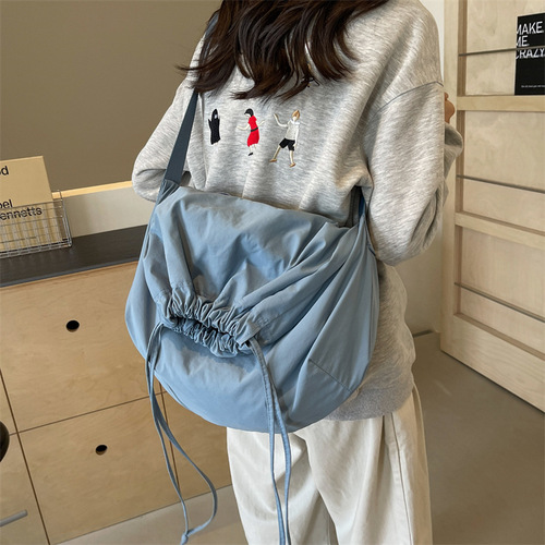 Stylish, versatile drawstring-closure crossbody bag with a minimalist, chic design—perfect for women. Bold-colored, lightweight, and easy-to-hold handbag option.