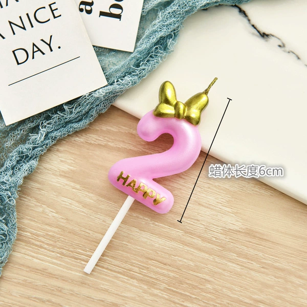 Black fuchsia candle with bow