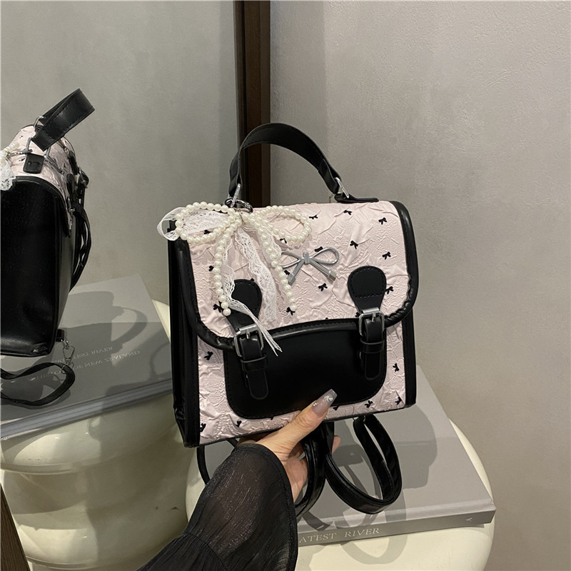 Escuela de viento impresión de arco mochila pequeña mujer verano 2025 nueva moda coreana estilo exterior mochila de viaje ocio