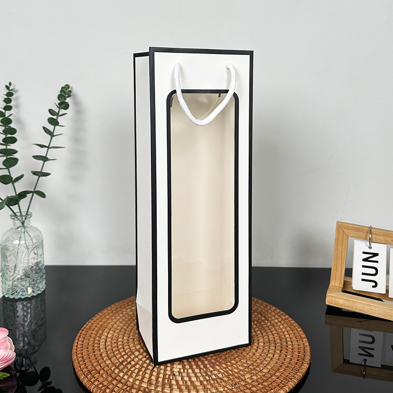Fondo blanco y marco negro; cartón blanco; bolsa de vino tinto 12,5*8,5*36cm