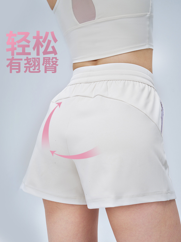 Verano nuevo estilo levantamiento de cadera pantalones cortos de yoga sueltos y simples mujeres pantalones de cuatro puntos delgados con cordón pantalones deportivos para correr