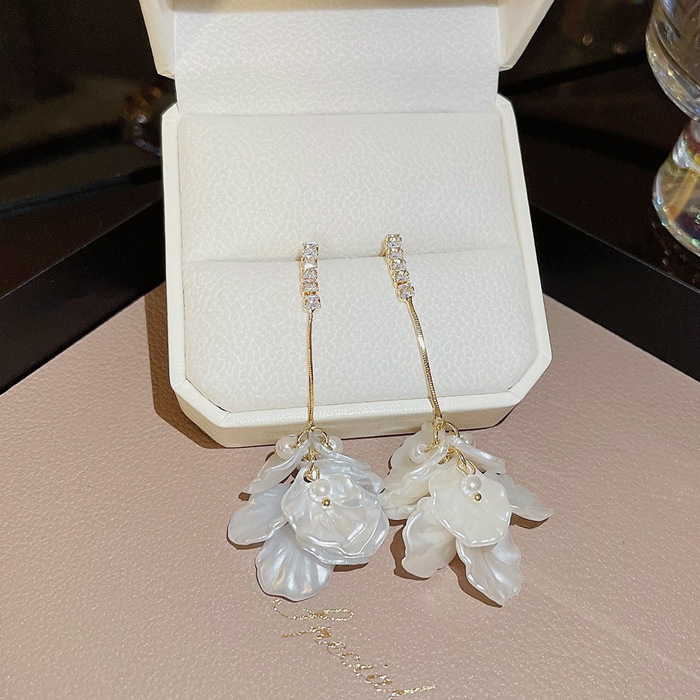 S925 aguja de plata elegante borla pendientes de alta gama simple cara de adelgazamiento pendientes de todo fósforo estilo coreano nuevos pendientes de moda al por mayor