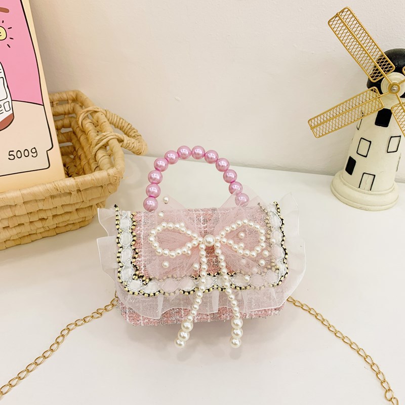 Bolsa de hombro coreana para niñas, arco de perlas, lindas flores, bolso de mochila para bebés, nuevo tipo de bolso para niños fragante.