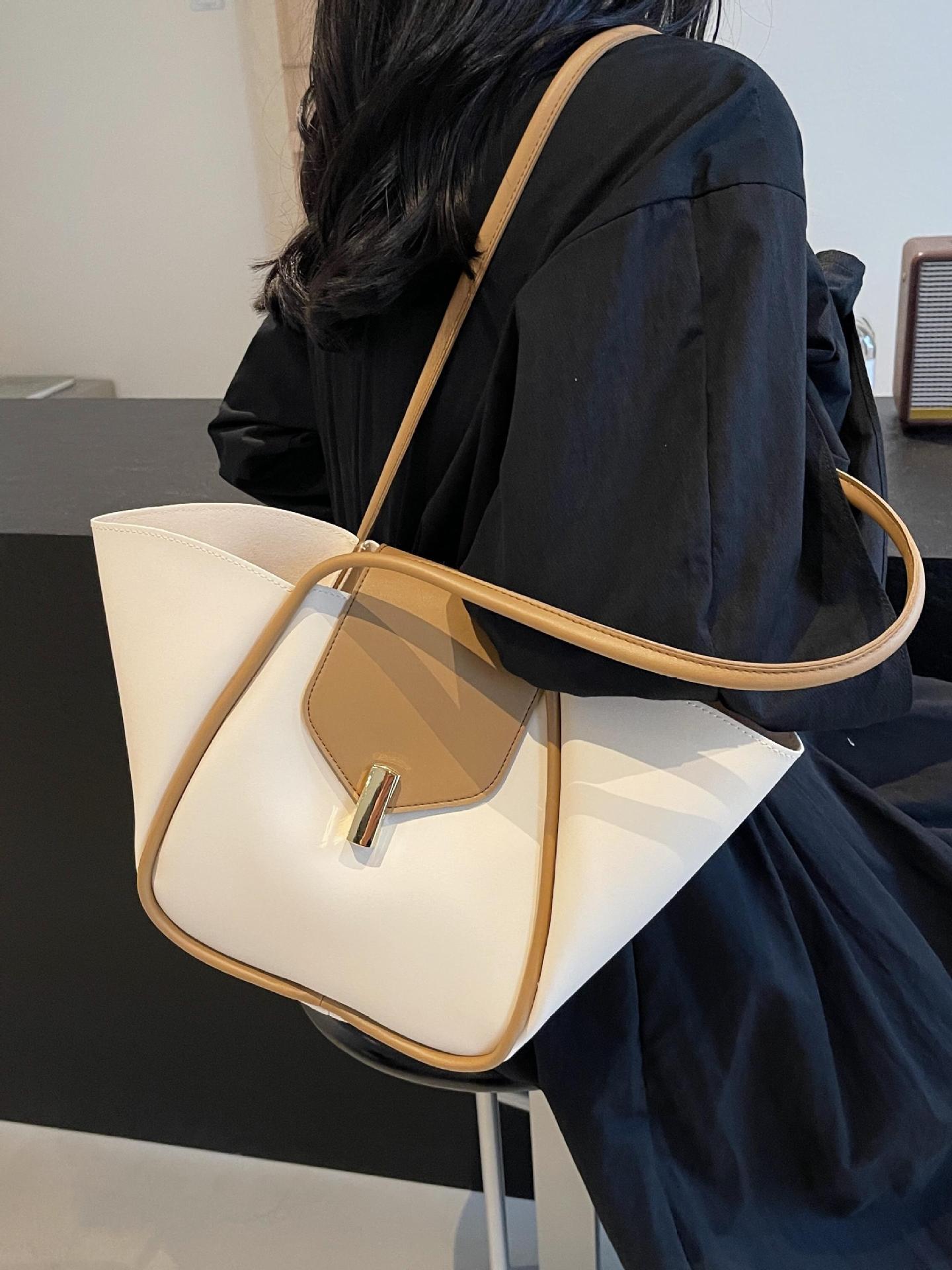 Bolso de cubo de gran capacidad explosivo transfronterizo para mujer 2025 nuevo bolso de hombro casual simple bolso de viaje de cuero suave