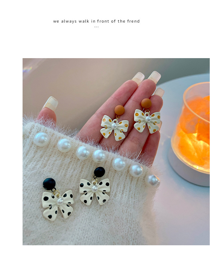 Korean 2021 New Earrings Autumn And Winter Women's Bow Pearl Earrings Refined Grace Earrings Ear Studs Tide display picture 8