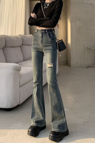 Fashionable high street hot girl micro-trumpet jeans women's spring and autumn new style broken hole design high waist slimming all-matching horseshoe pants