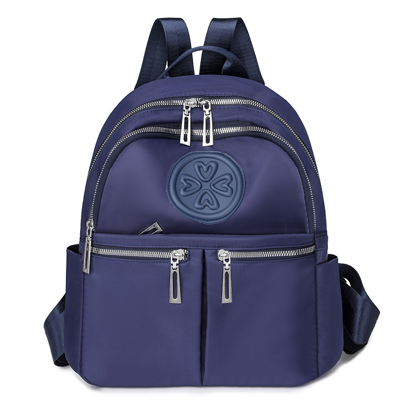 2025 nueva mochila de nailon casual para mujer, mochila de viaje al aire libre de gran capacidad en relieve de moda, mochila escolar para estudiantes