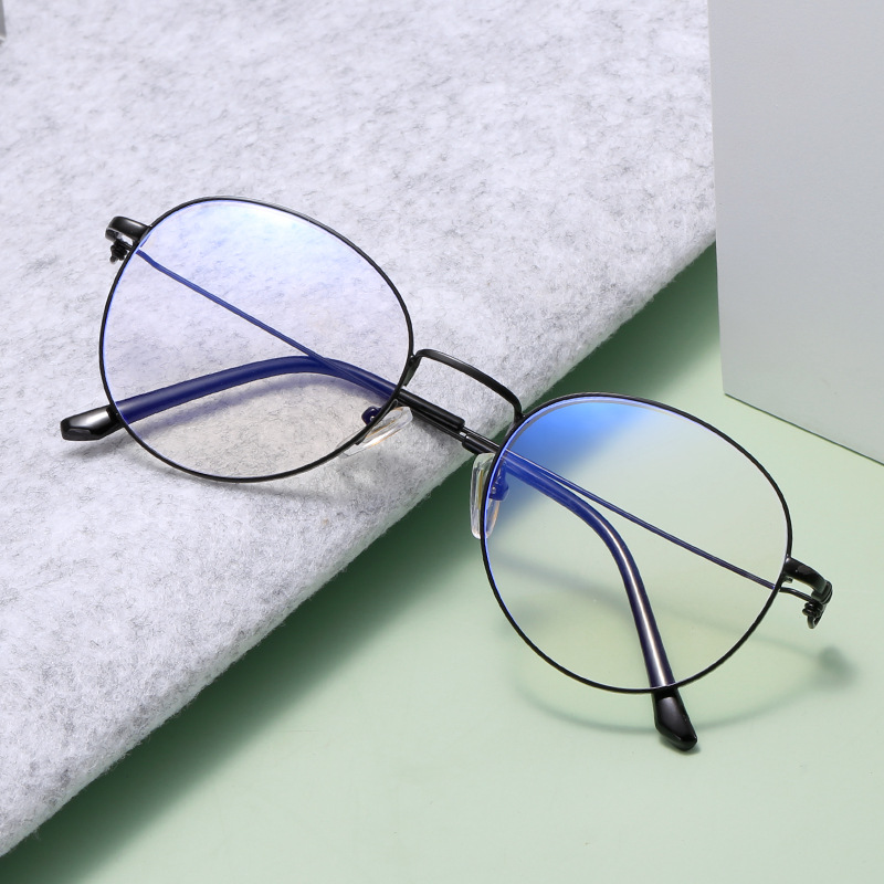 Óculos versáteis e minimalistas com proteção contra luz azul, armação redonda de metal unissex, armações de óculos modernas para miopia, disponíveis para compra no atacado._voghion.com