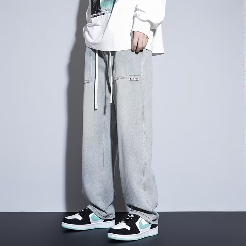 Pantalones casuales de primavera y otoño para hombres, estilo suelto de Hong Kong, sarga, pantalones de trapeador de pierna ancha de arte de moda, jeans deportivos