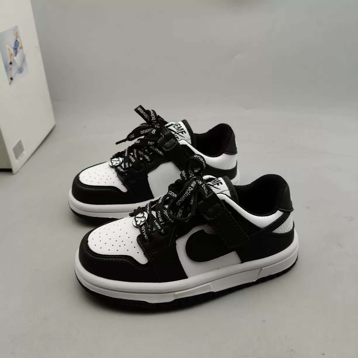 儿童板鞋春季新款皮面防水黑白拼色百搭休闲鞋子